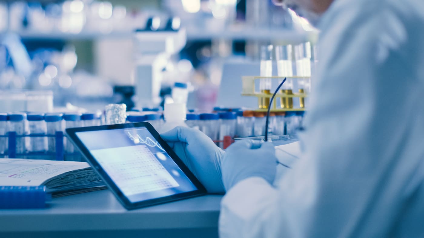 Scientist reviewing formulation data