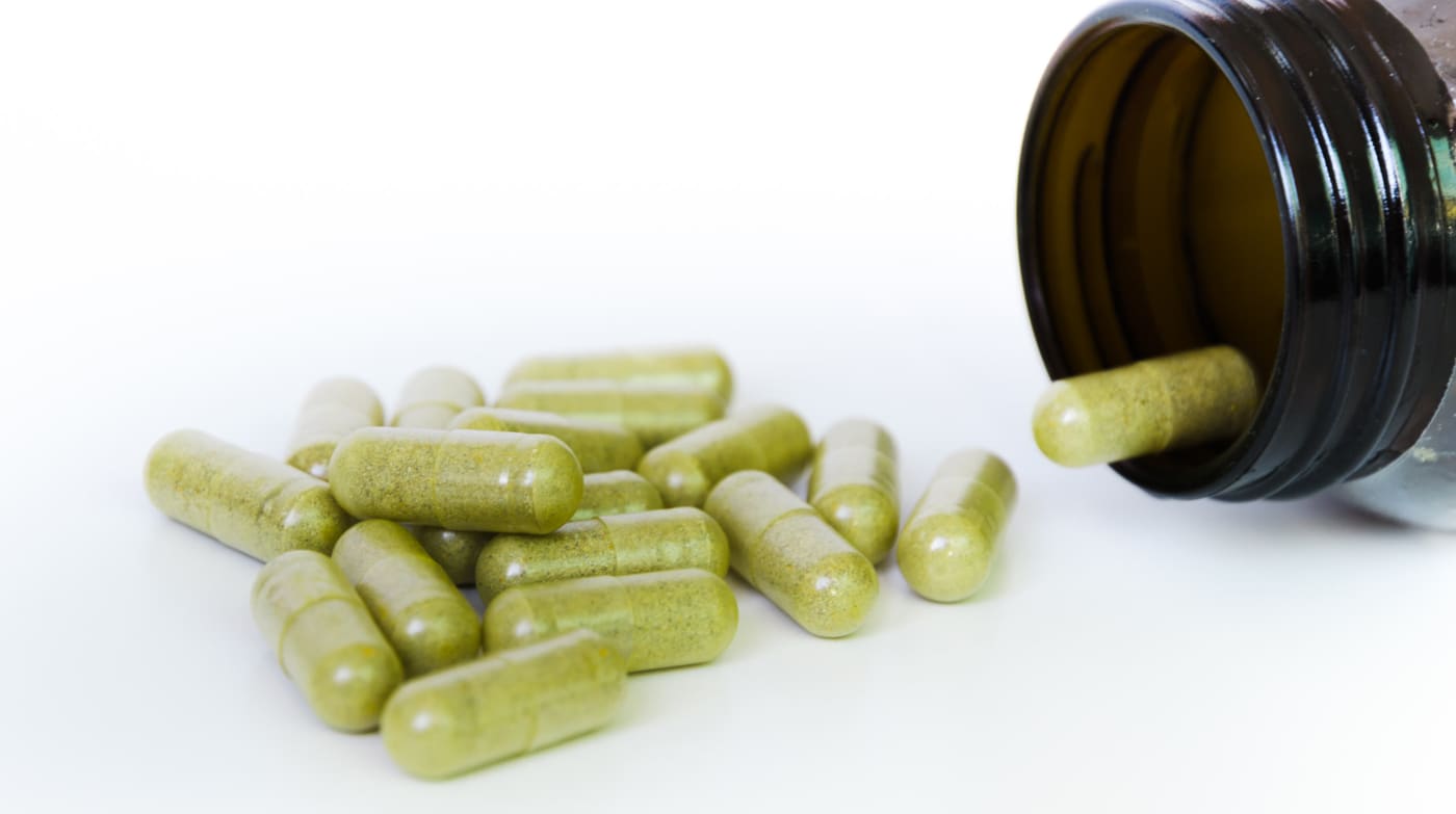 Green supplement capsules